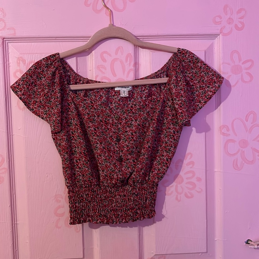 A floral red blouse